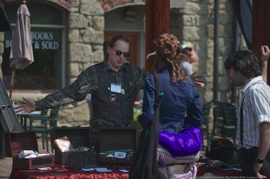 Steampunk vendor shows off his hand crafted wares.